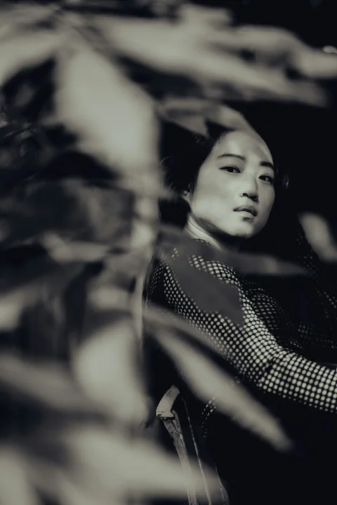 woman in black and white checkered shirt