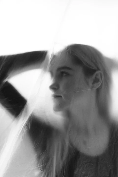 womans face in grayscale