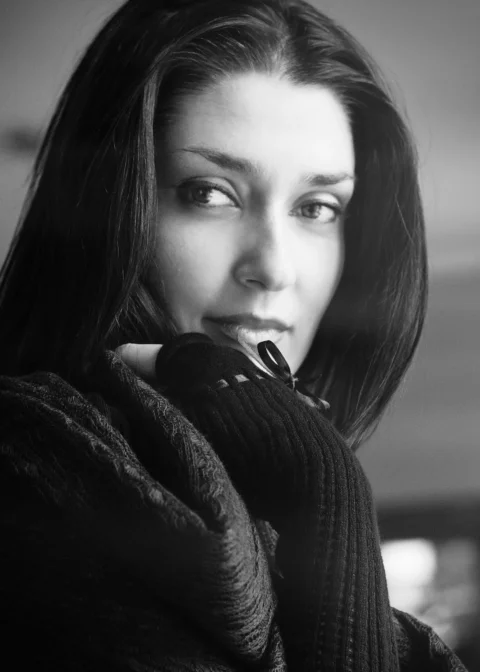 grayscale photo of woman in knit sweater