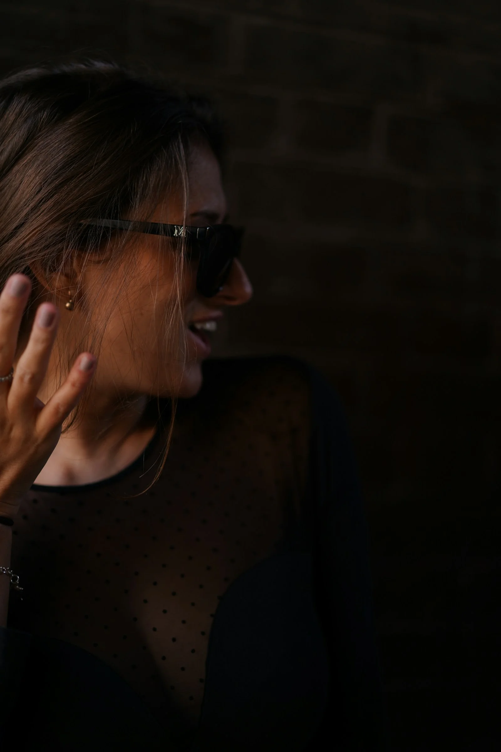 woman in black tank top wearing black sunglasses