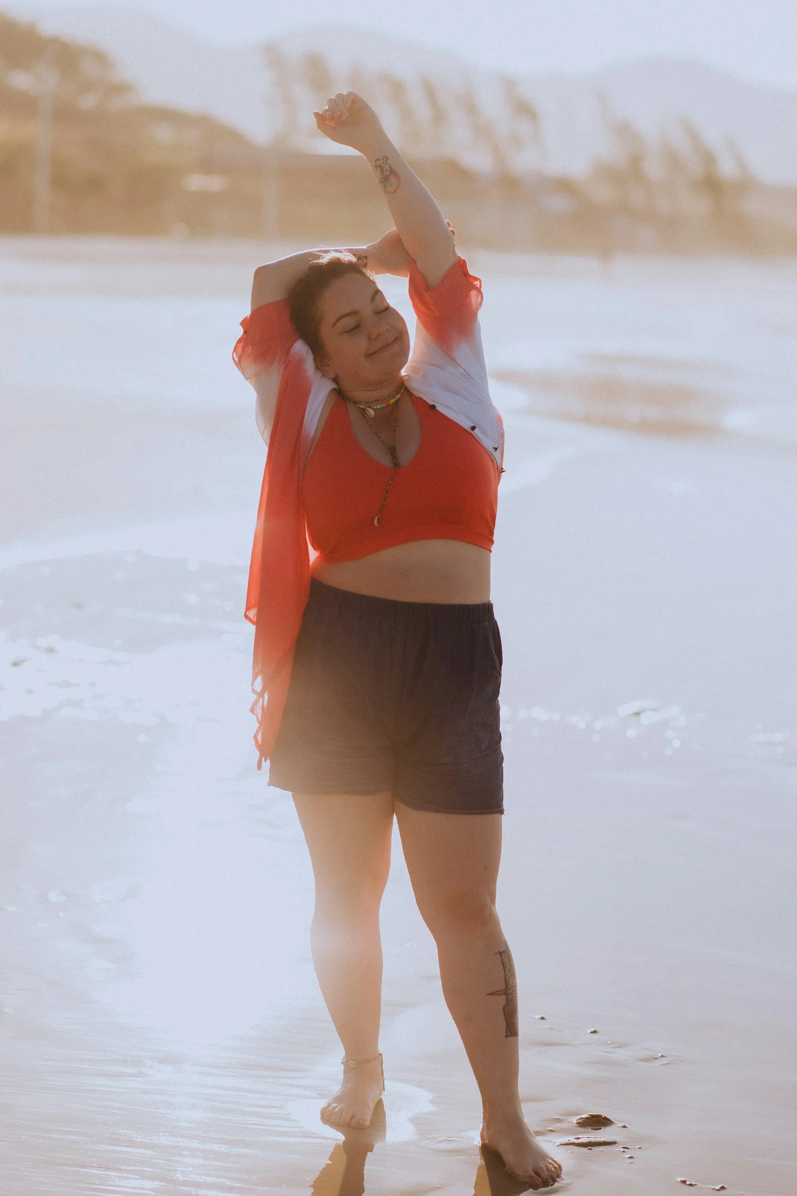 a woman in an orange shirt