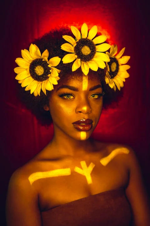 woman with yellow sunflower on her head
