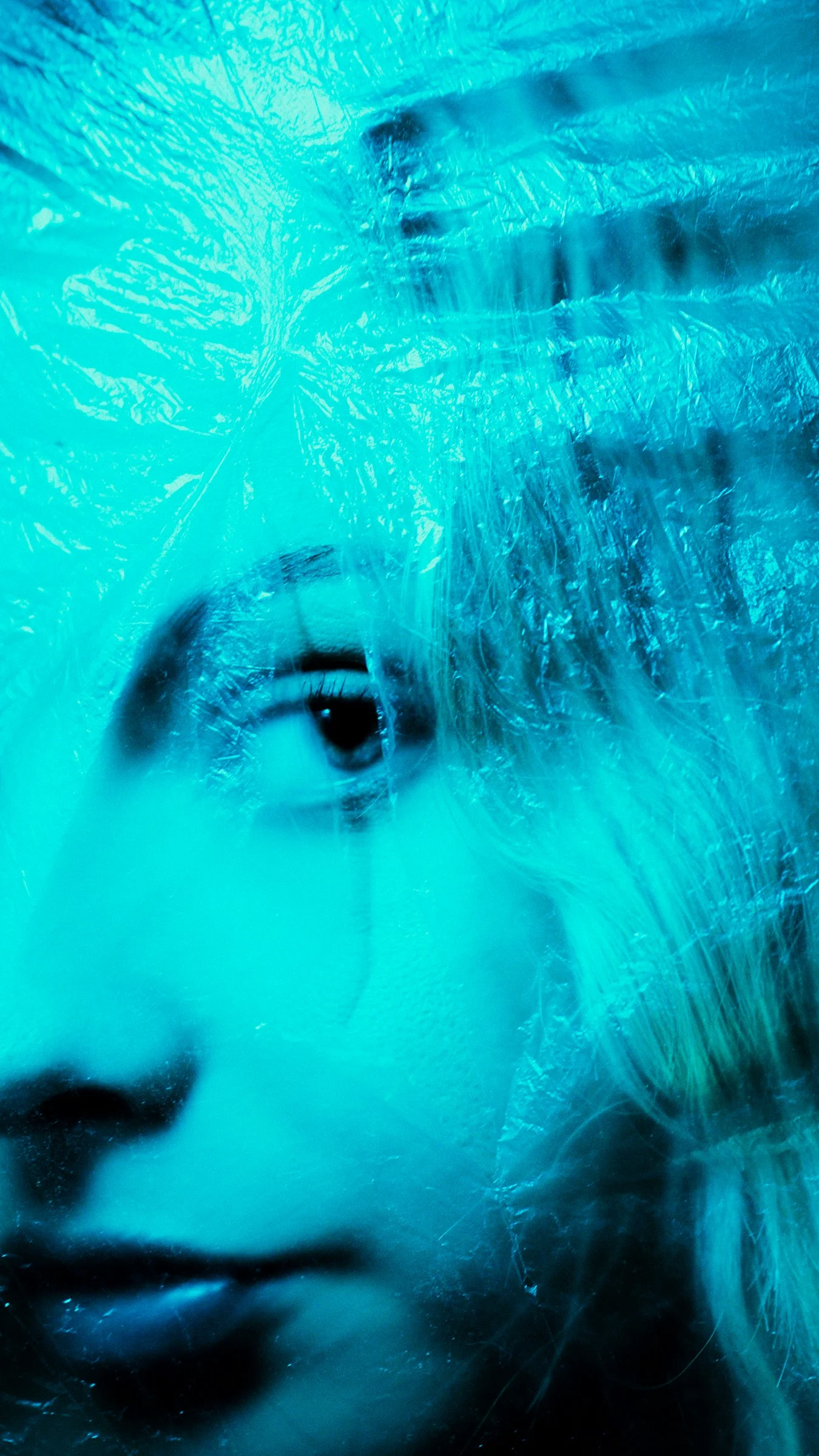 A close up of a woman's face with a blurry background