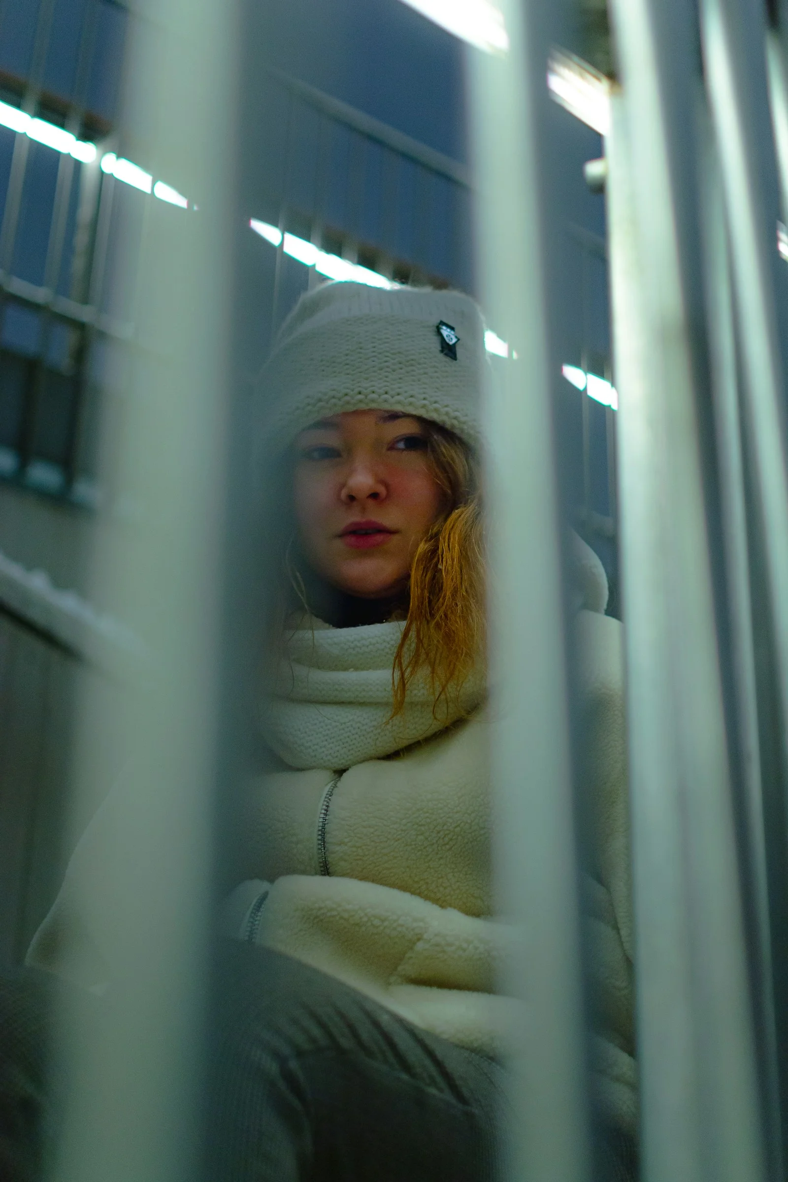 woman in white knit cap and white scarf