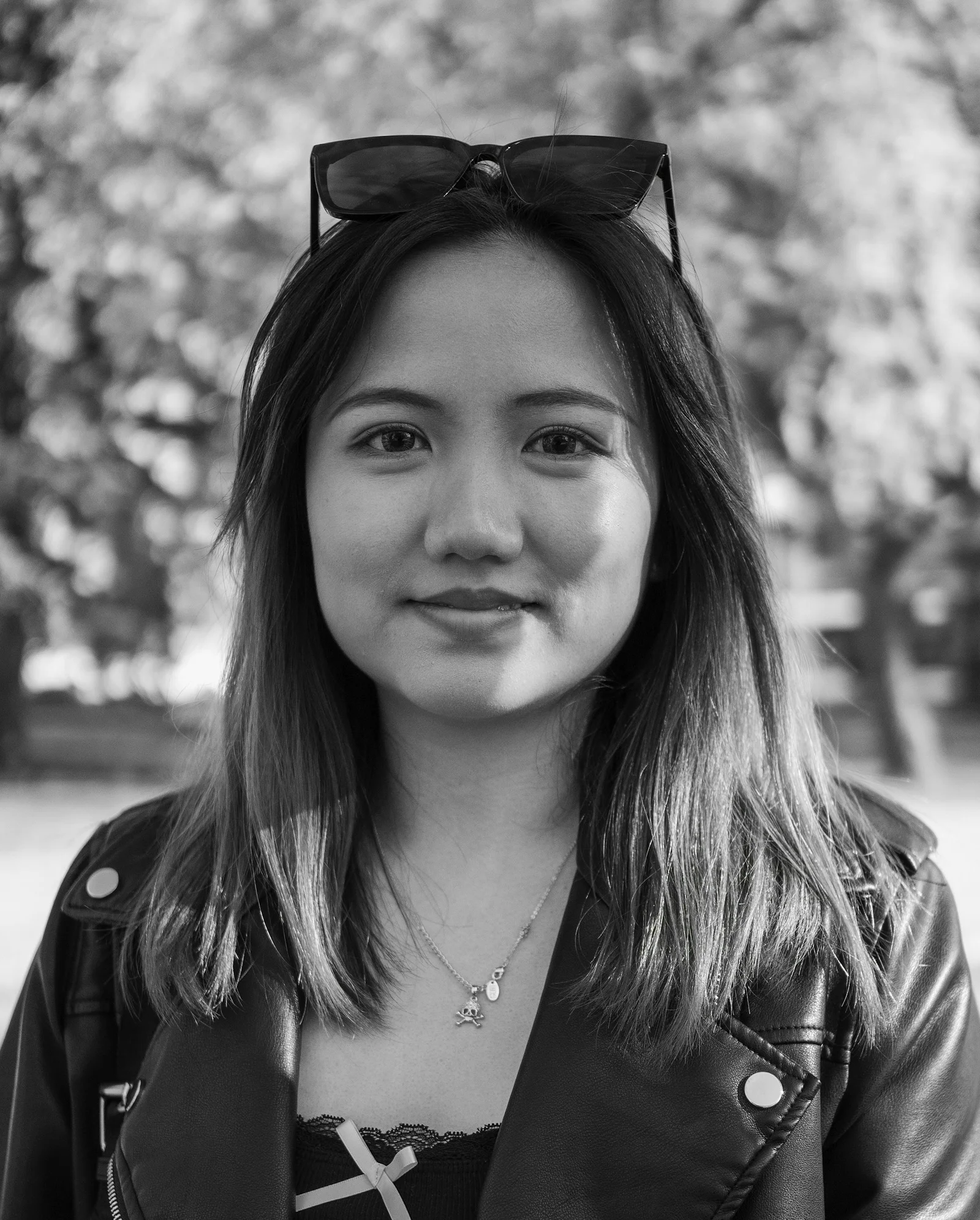 A young woman poses for a black and white photo