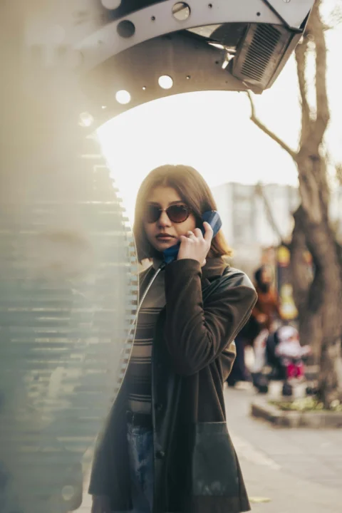 a woman is talking on a cell phone