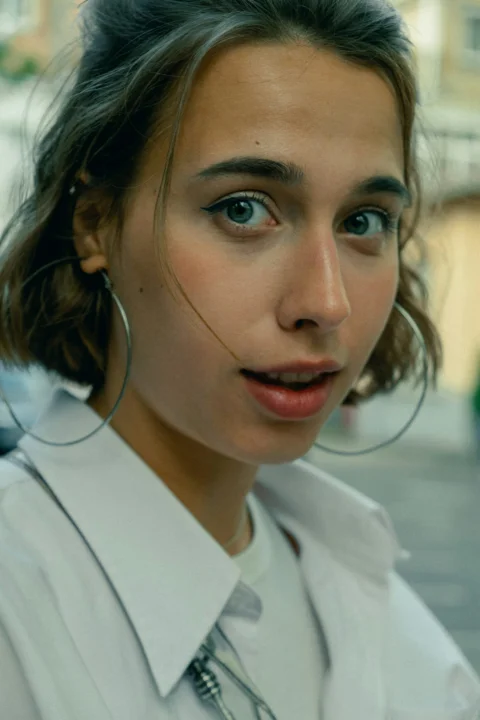 woman in white collared shirt