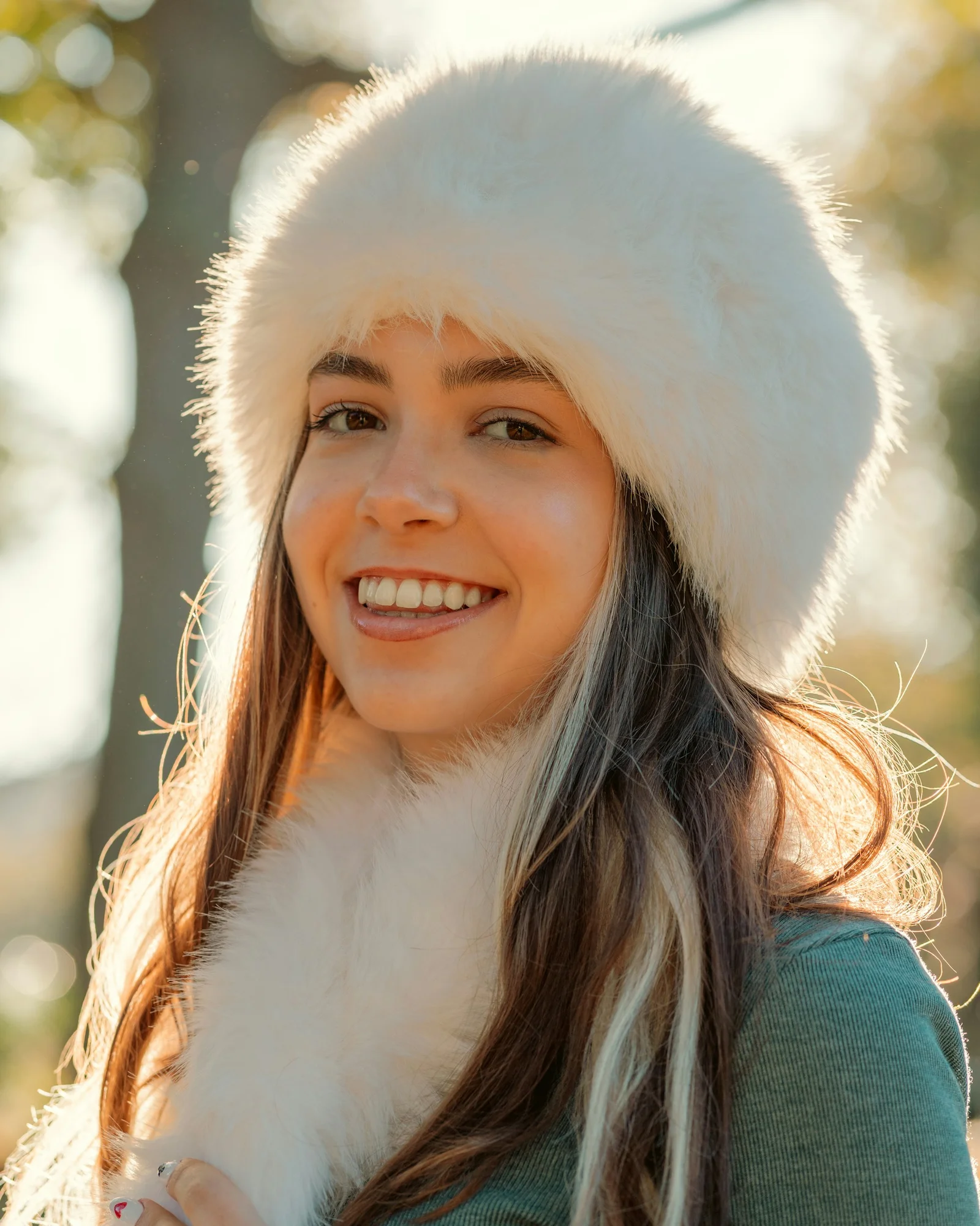 Smiling woman wearing a fluffy white hat