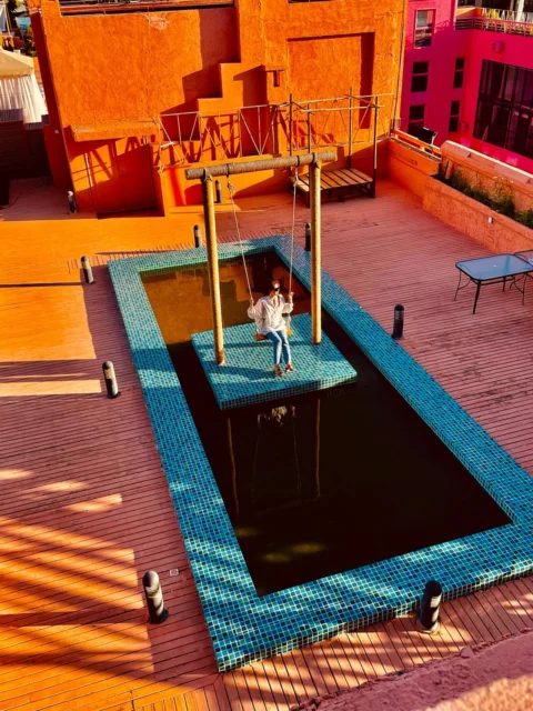 morocco, woman, swing, swimming pool
