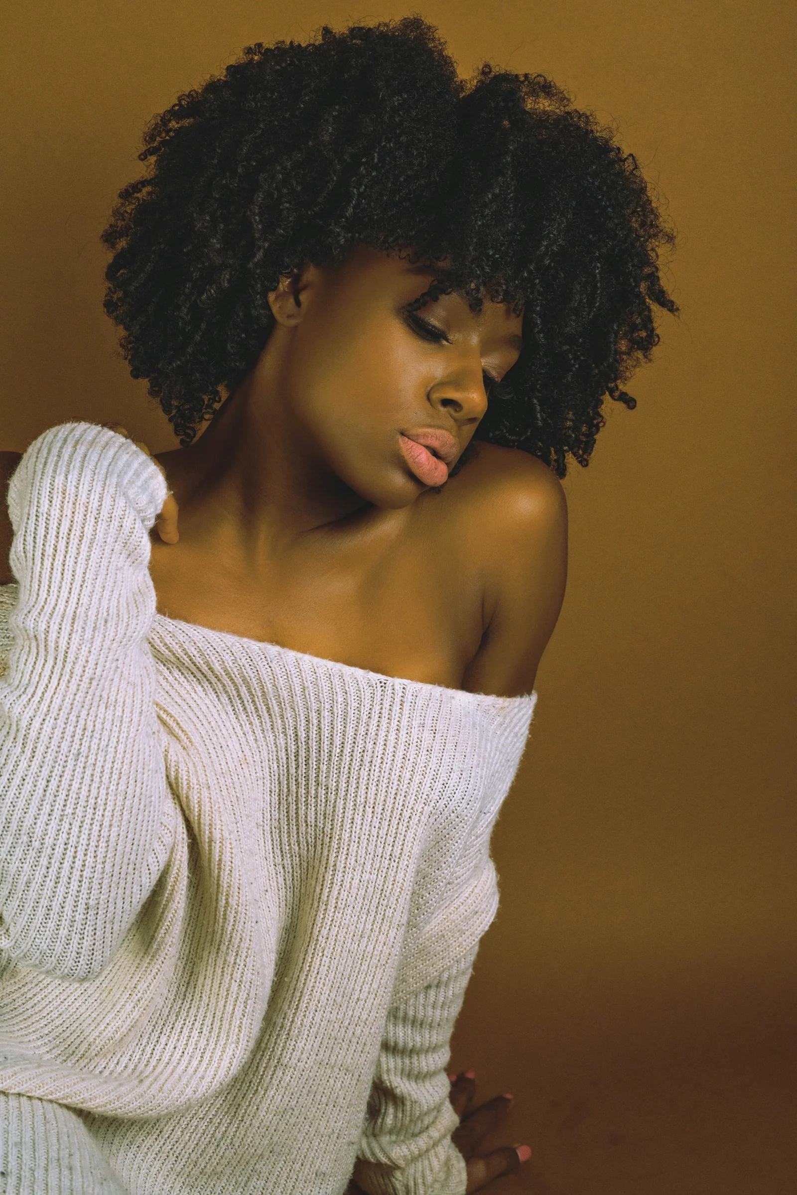 Beautiful woman in off-the-shoulder sweater