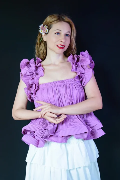 purple blouse, flower in hair, woman, blonde