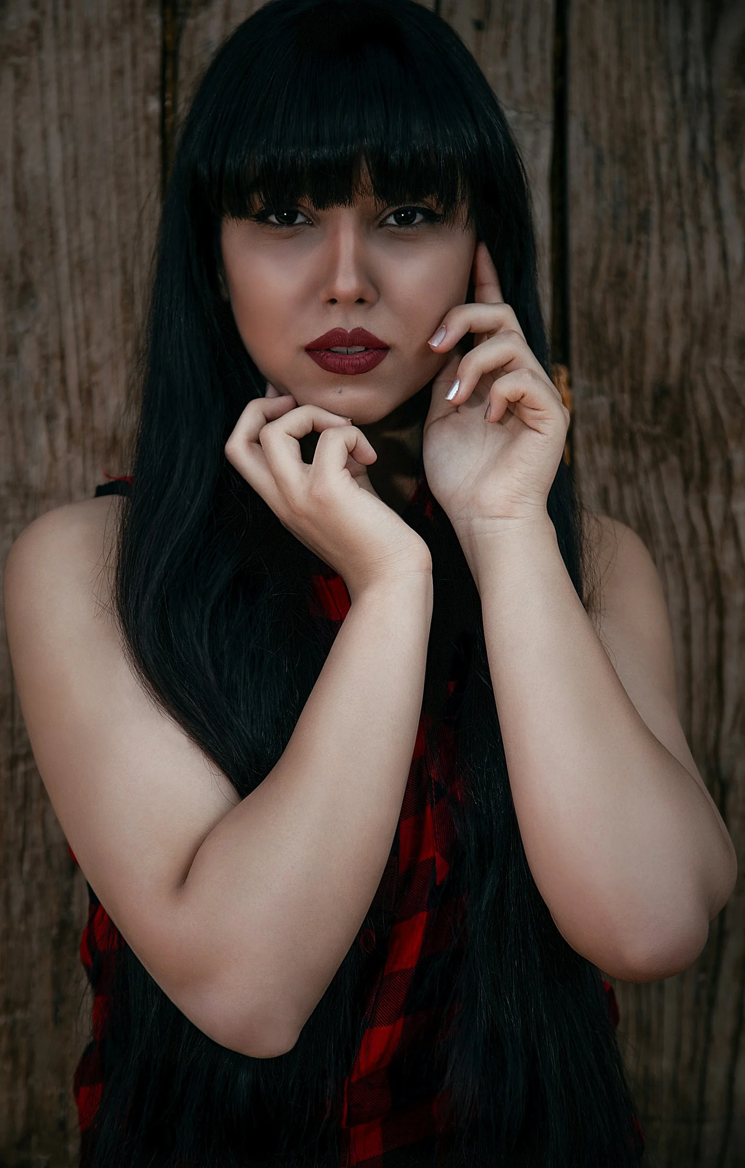 woman in red lipstick and black mascara