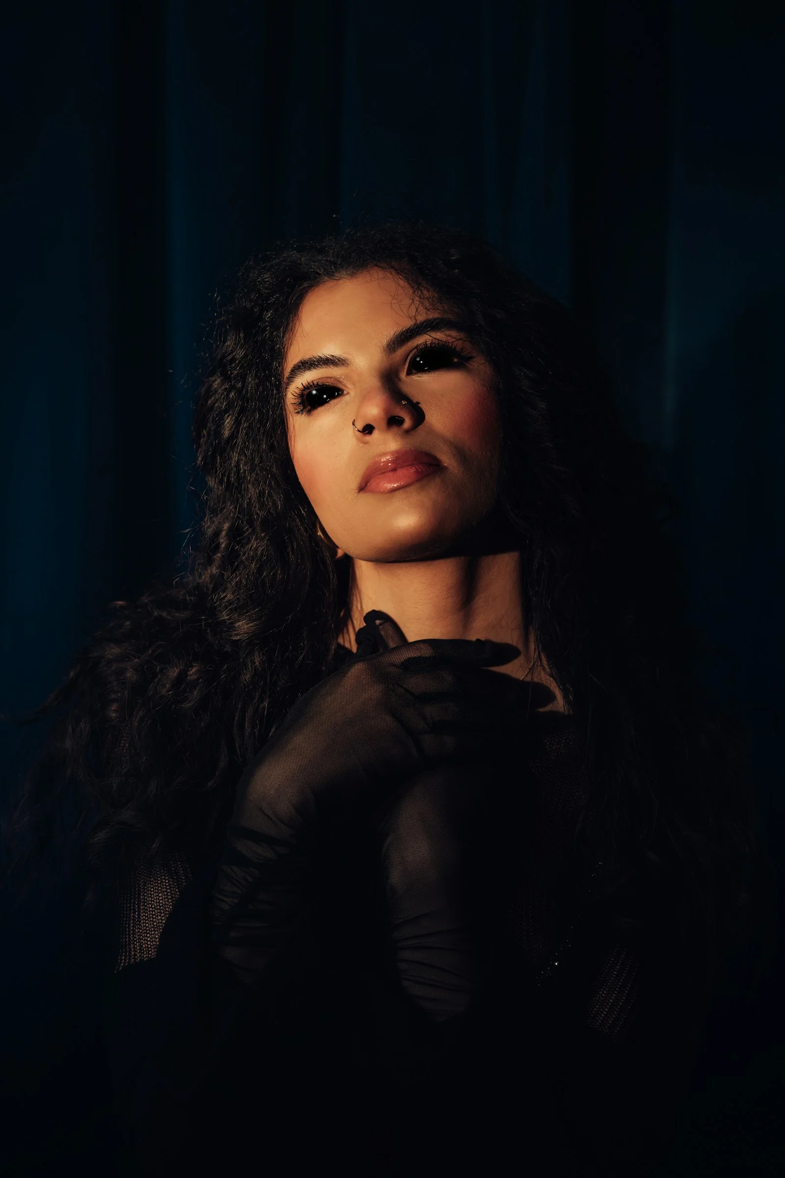 A woman poses with a dramatic and eerie look