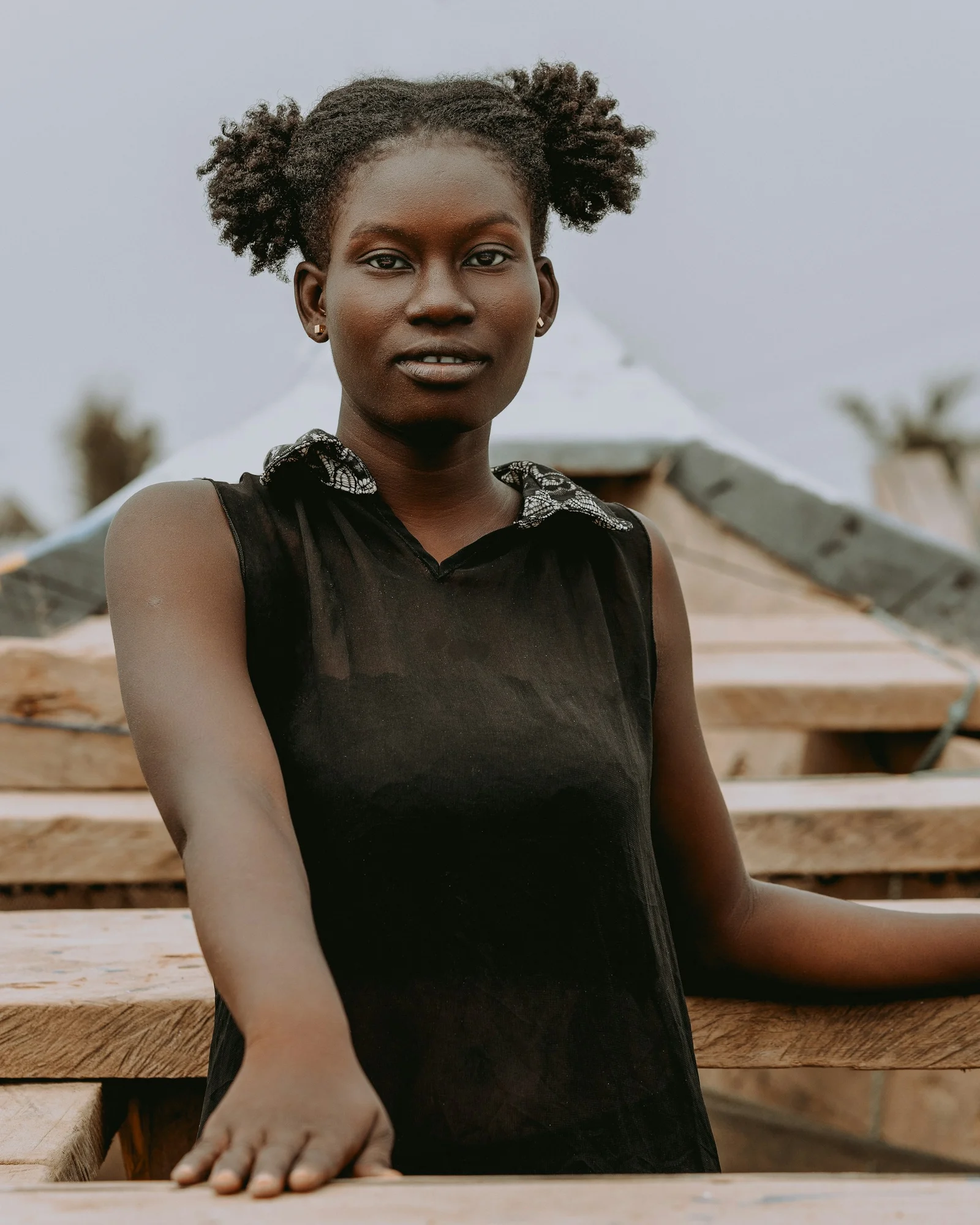 A young woman smiles at the camera