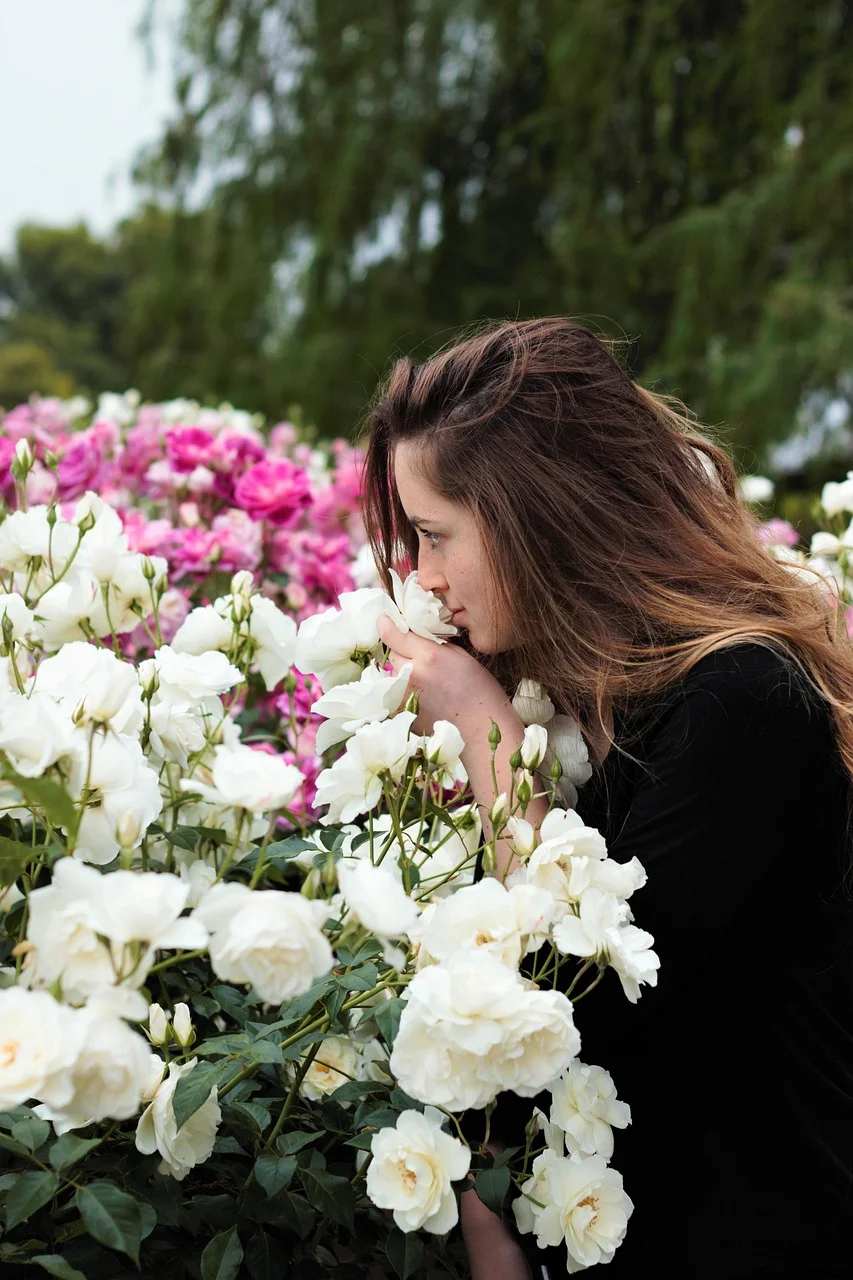 sniffing flowers, sniffing roses, young, woman