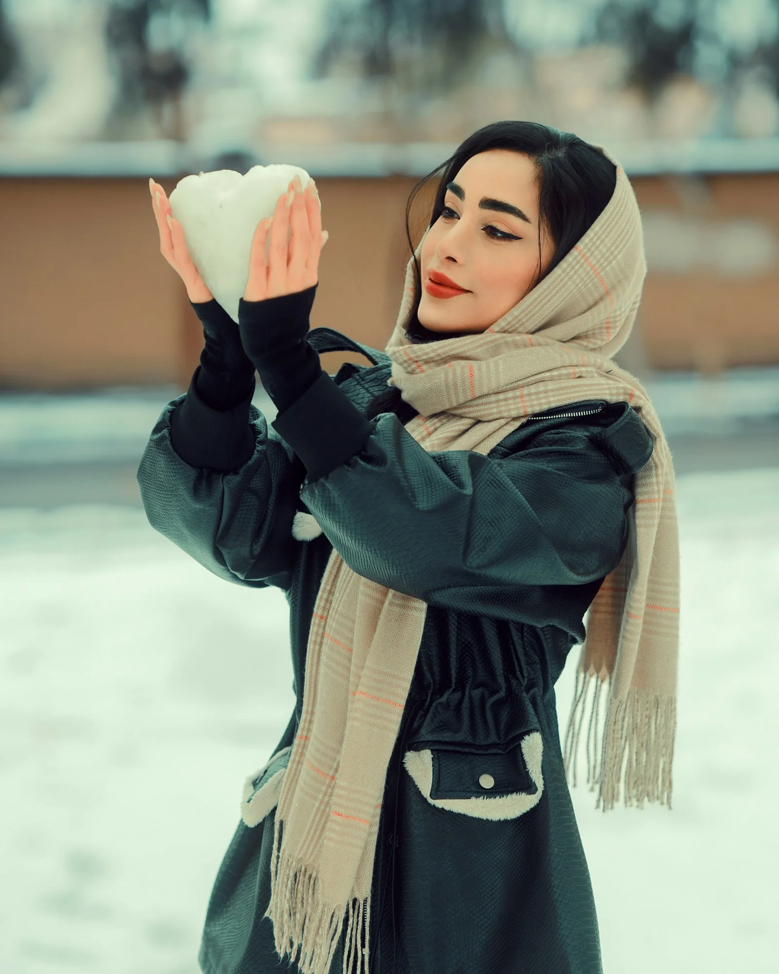 a woman wearing a scarf and scarf around her neck