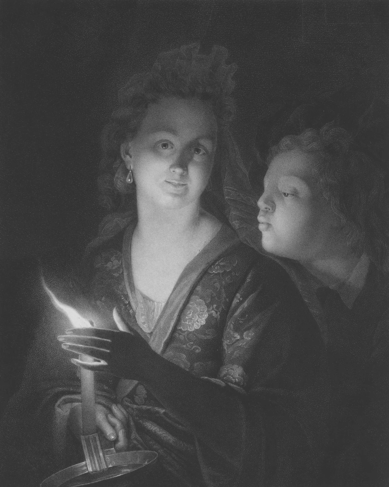 Two figures illuminated by a single candle in darkness