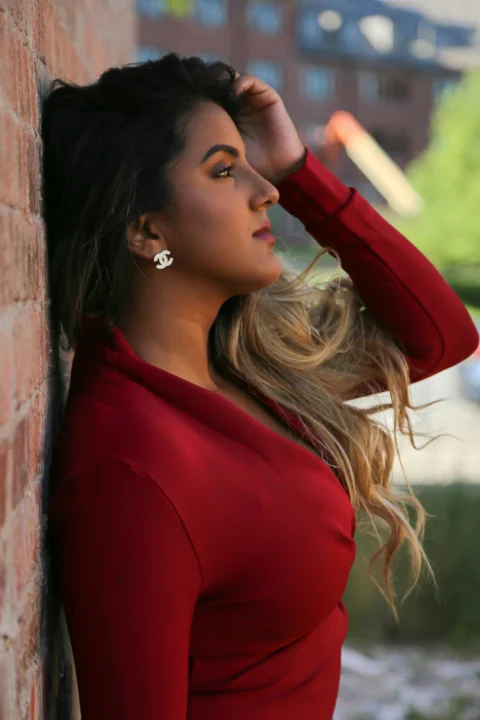 woman leaning on wall