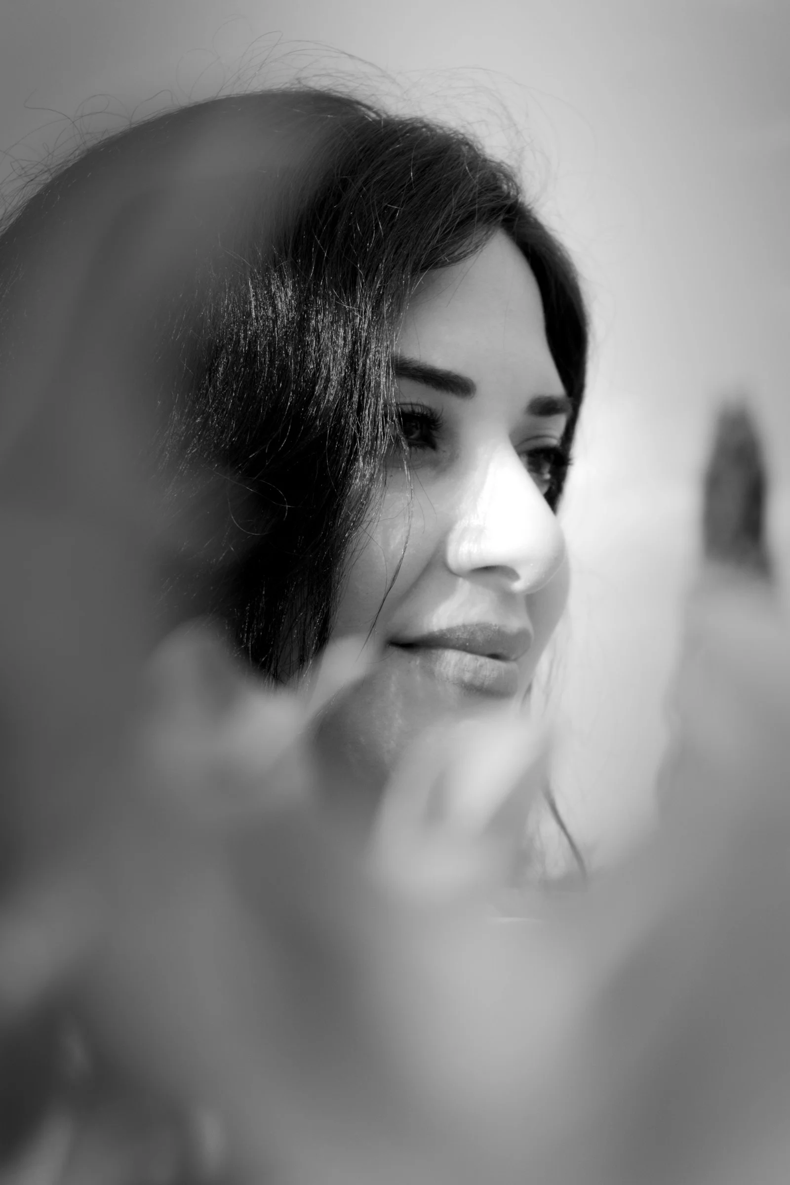Black and white portrait of a woman looking away