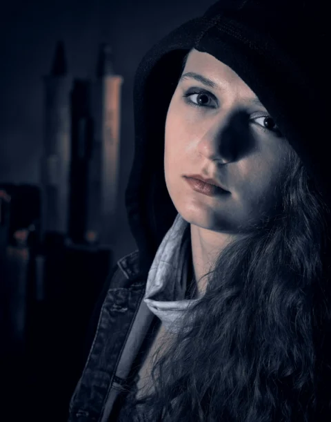 A woman with long hair wearing a hoodie