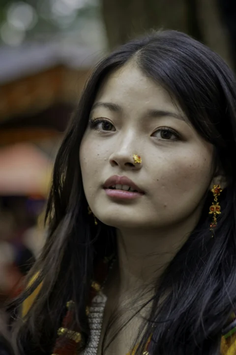 Young woman with ornate nose ring and earrings