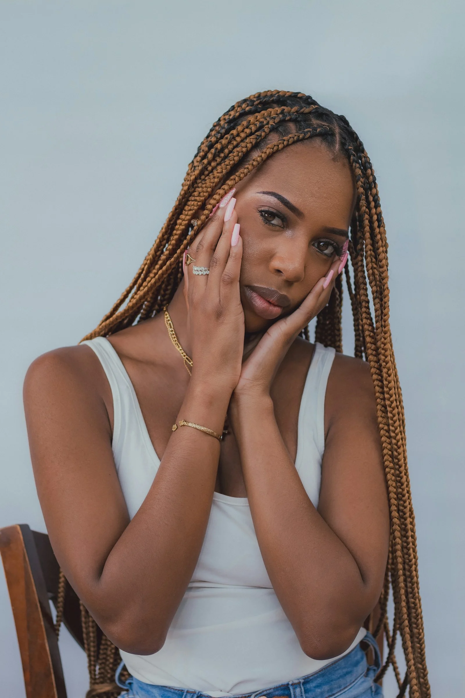 a woman with her hands on her face