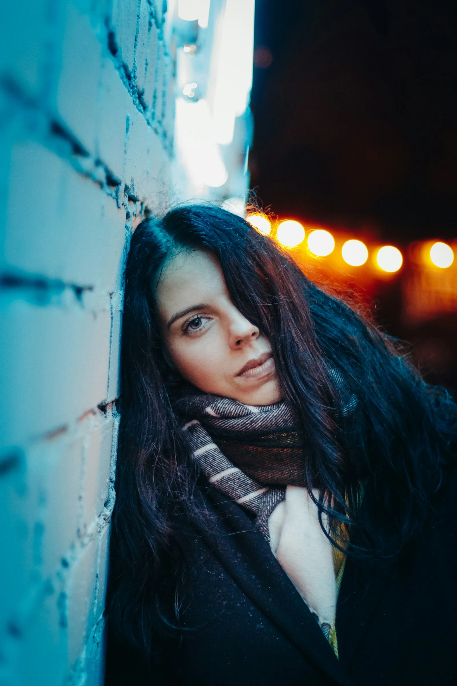 woman leaning on wall