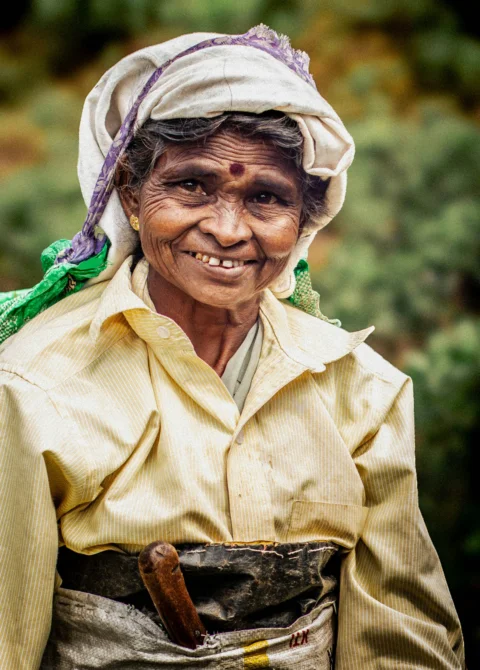 Smiling elderly woman with a headscarf and traditional clothing