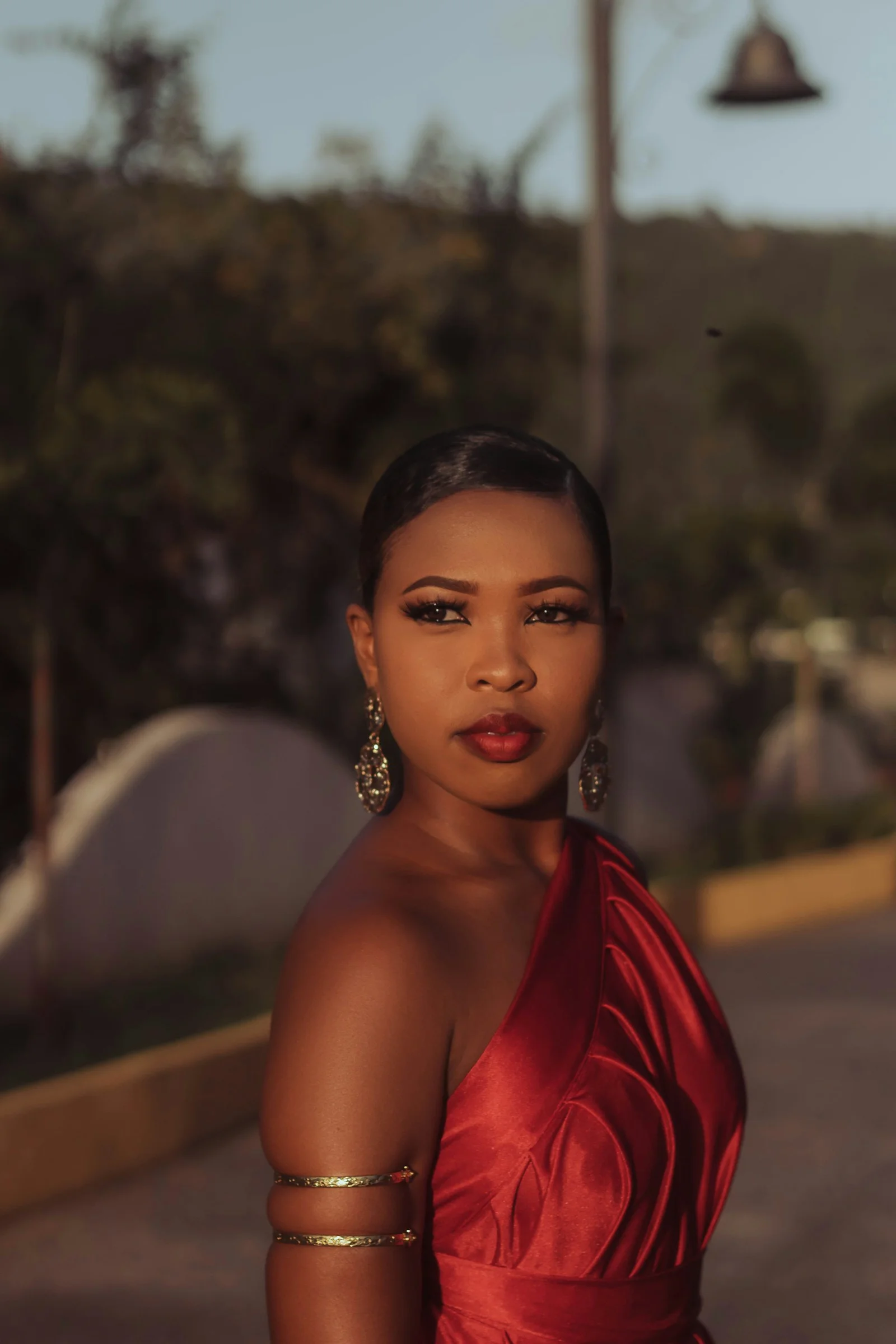 a woman in a red dress posing for a picture