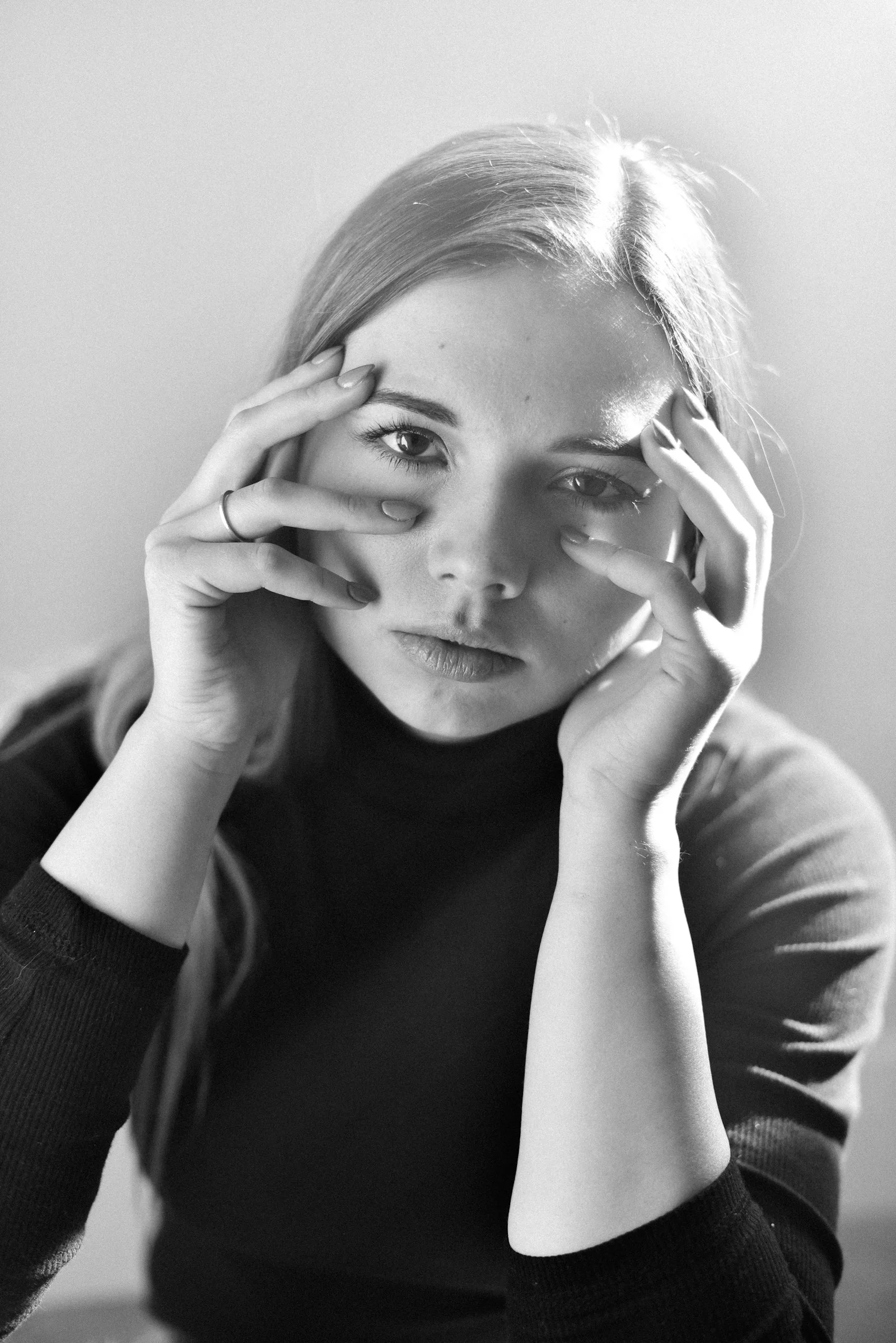 grayscale photo of woman in long sleeve shirt