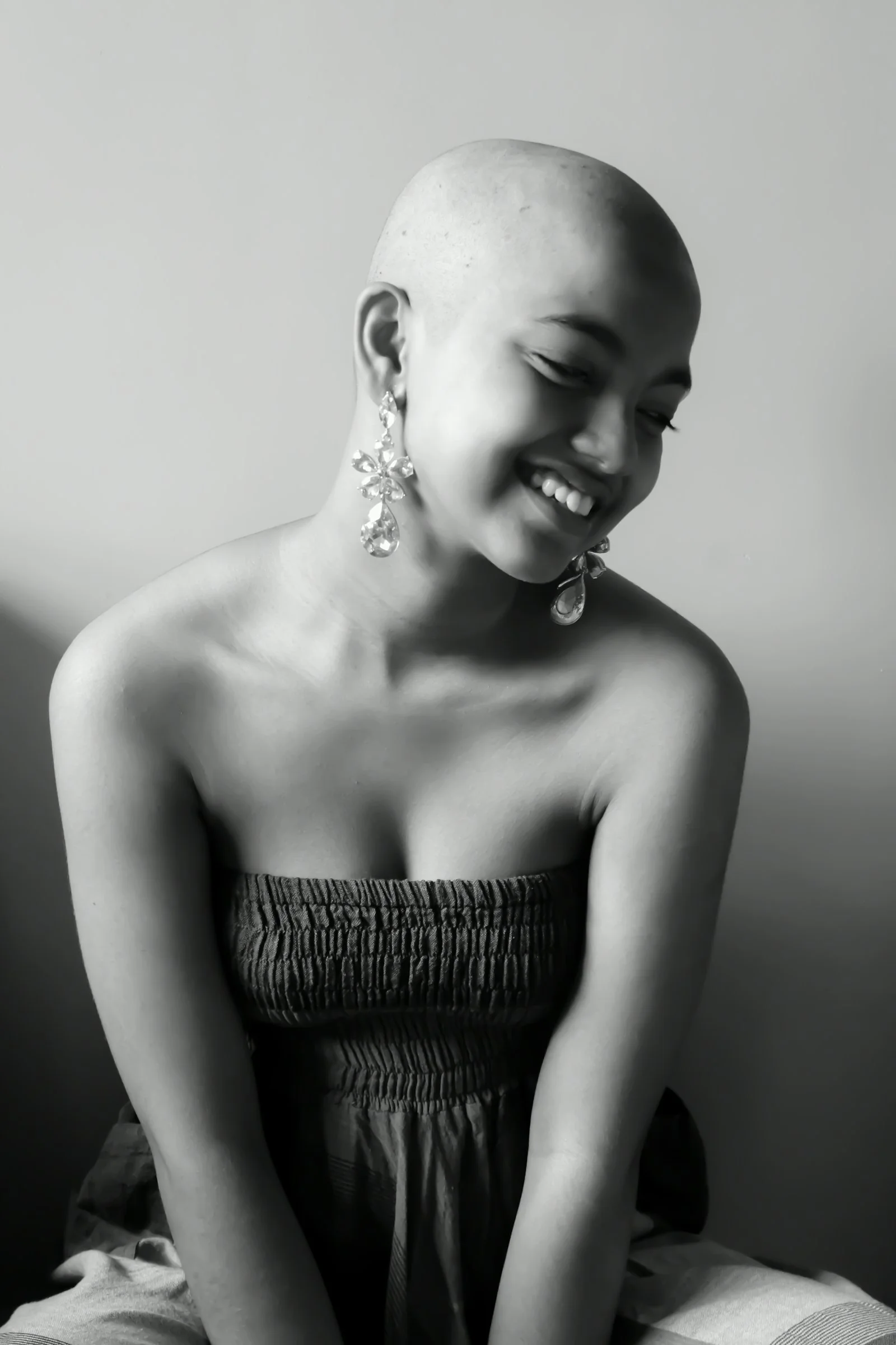 woman in tube dress smiling