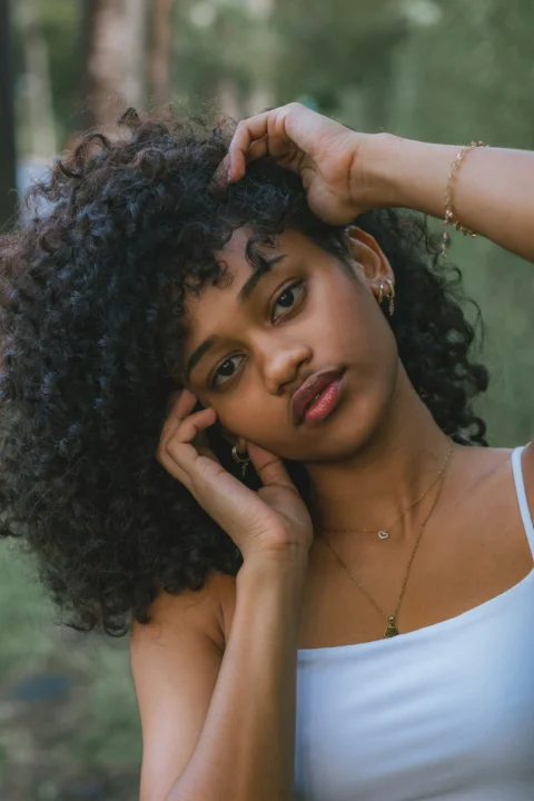 a woman with curly hair