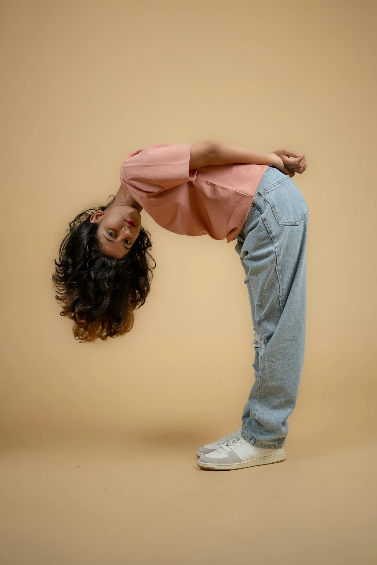a woman is doing a handstand on her head