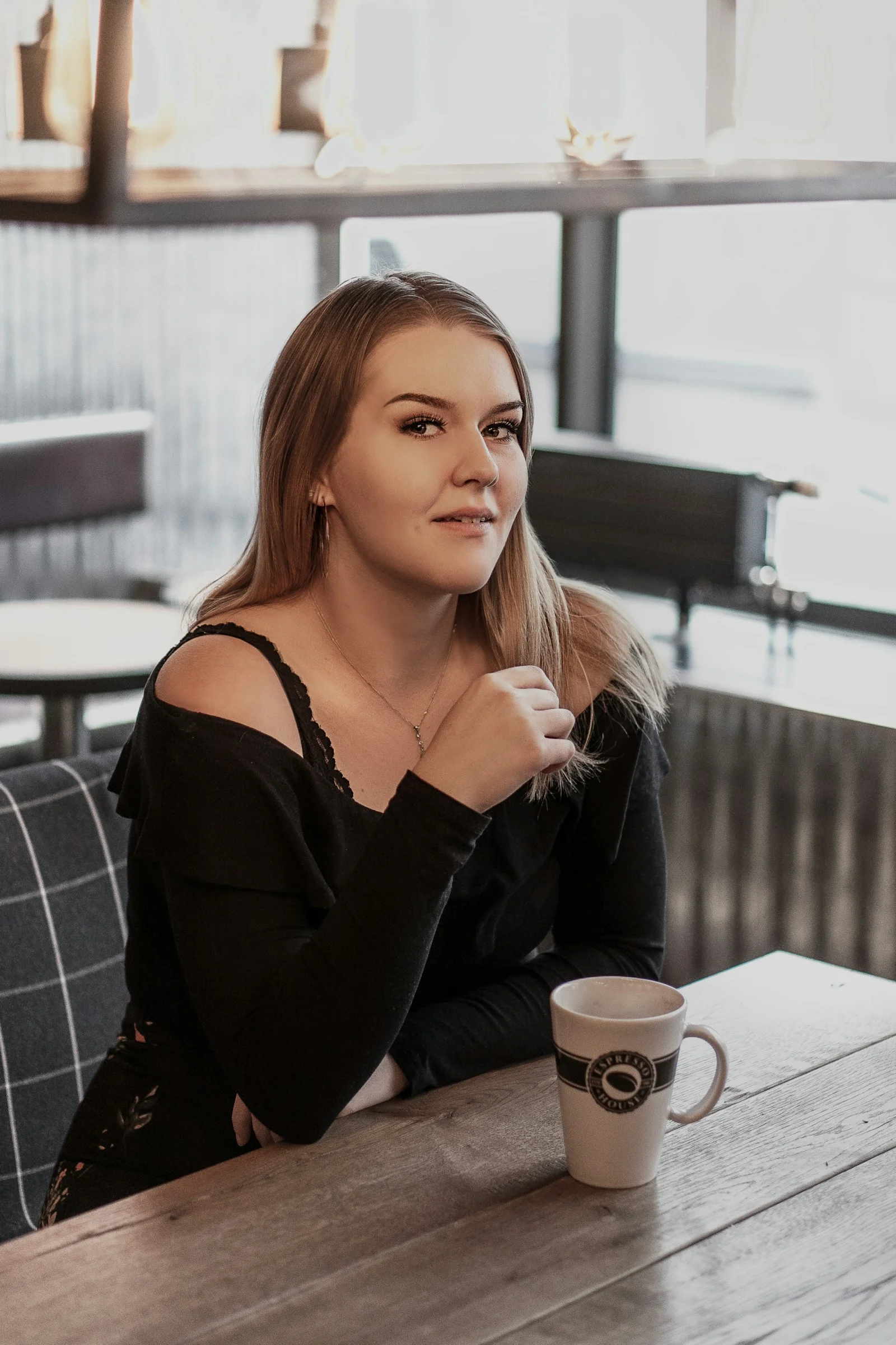 woman in black long sleeve shirt sitting on chair