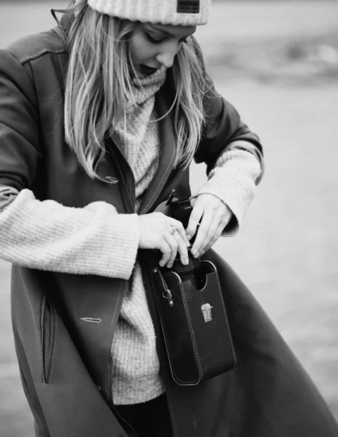 a person with a hat and a purse