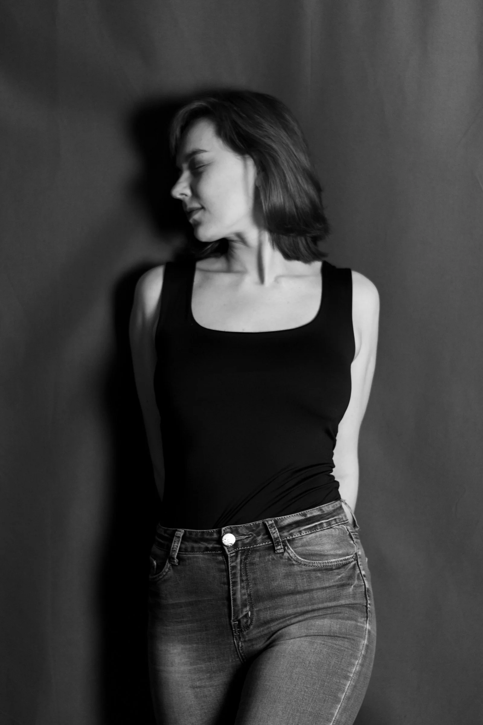A woman poses in black and white