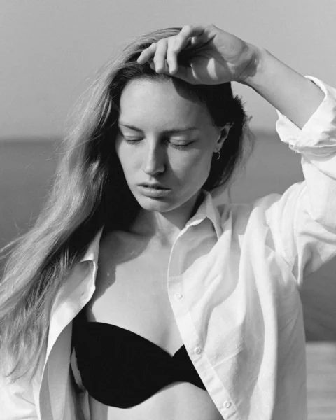 a woman with her hand on her head