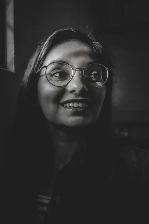 woman wearing black framed eyeglasses