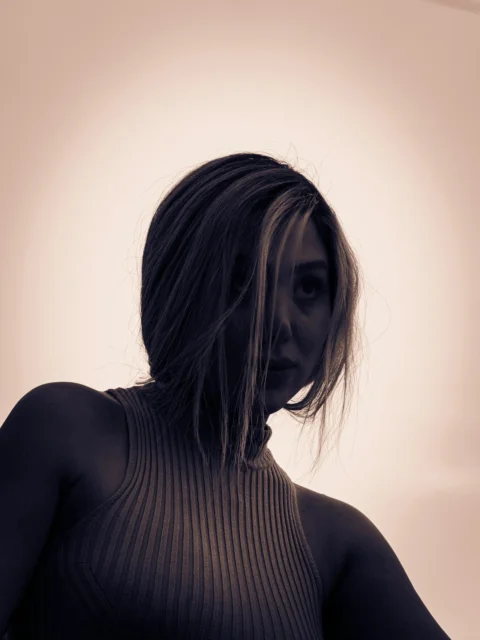 a woman with a knife in her hand