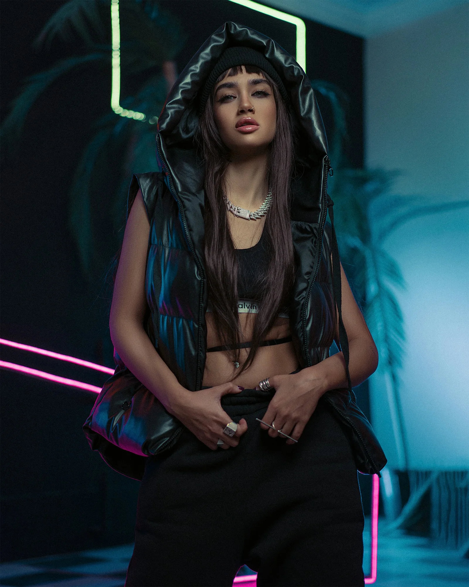 a woman wearing a black jacket and black pants