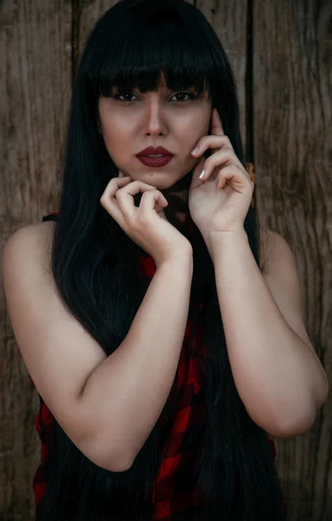 woman in red lipstick and black mascara