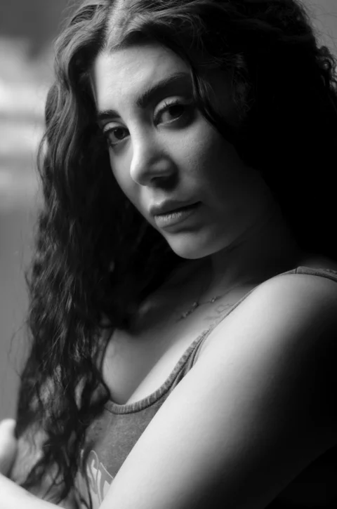 a black and white photo of a woman with long hair
