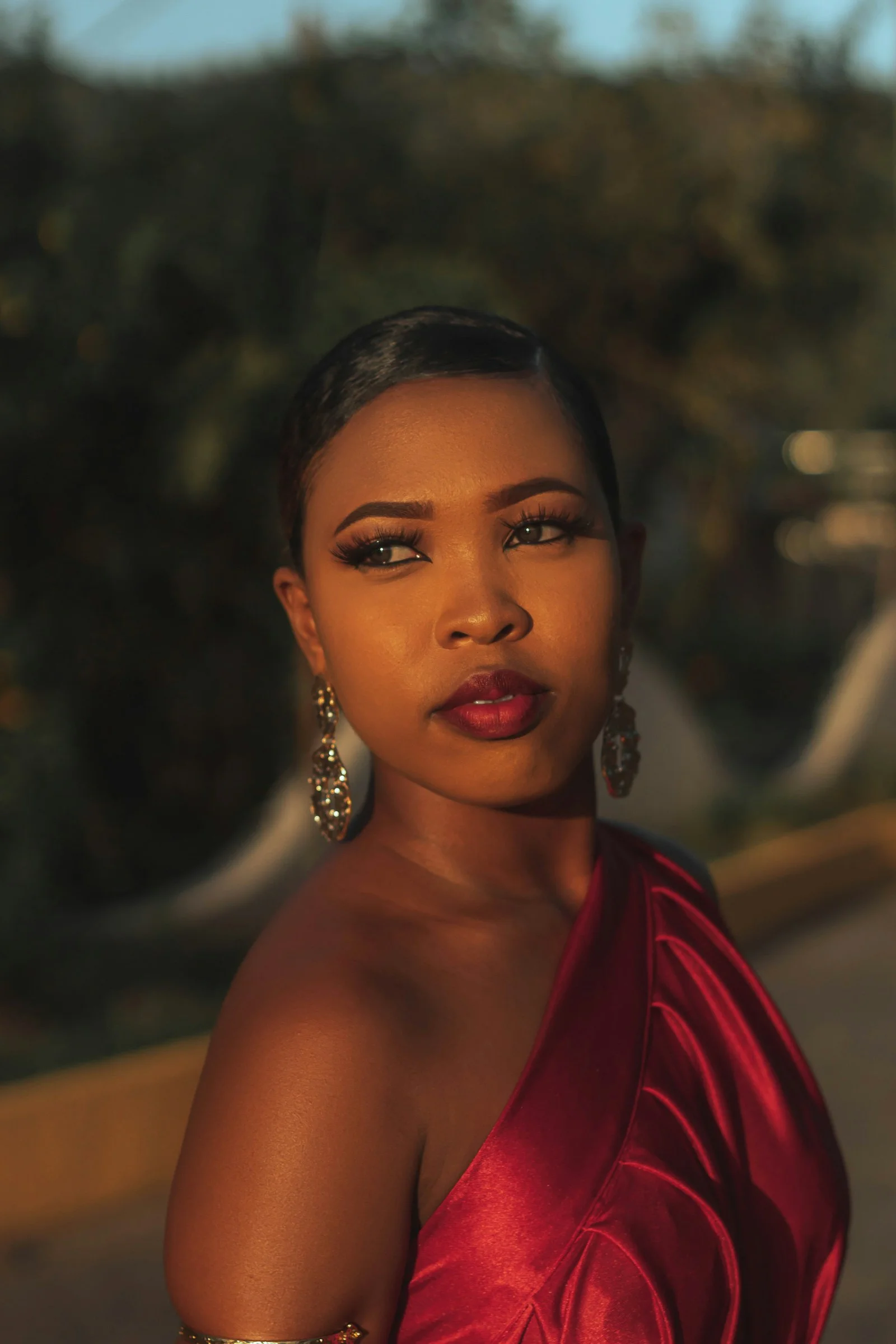 a woman in a red dress posing for a picture