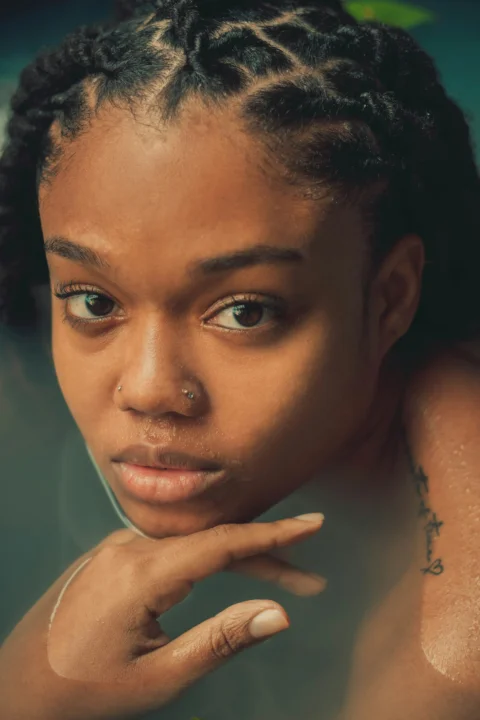 a close up of a person with a tattoo on her arm