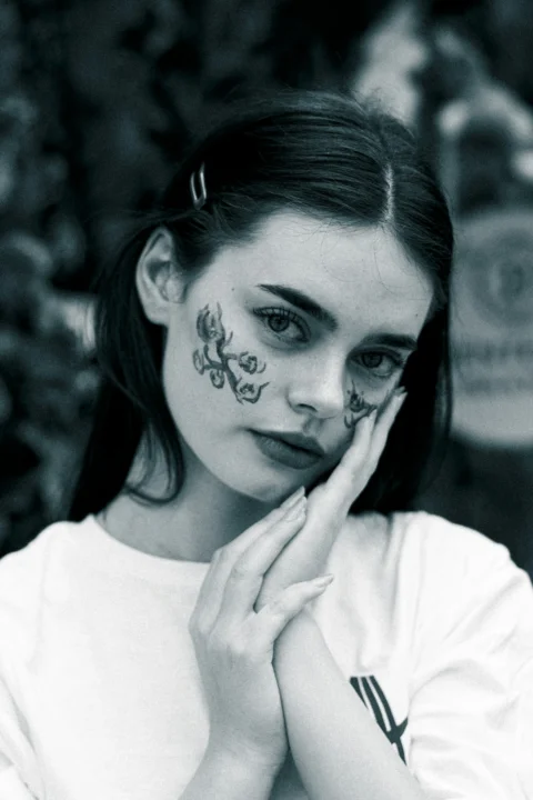 A woman with face paint on her face