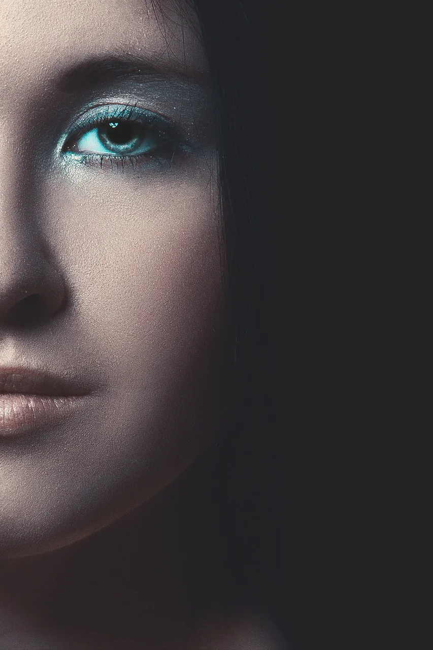 mystical portrait of a girl, eyes, black background, young woman