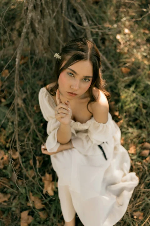 Young woman in white dress outdoors