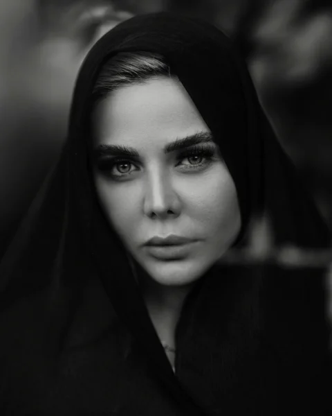 A woman with a black veil on her head