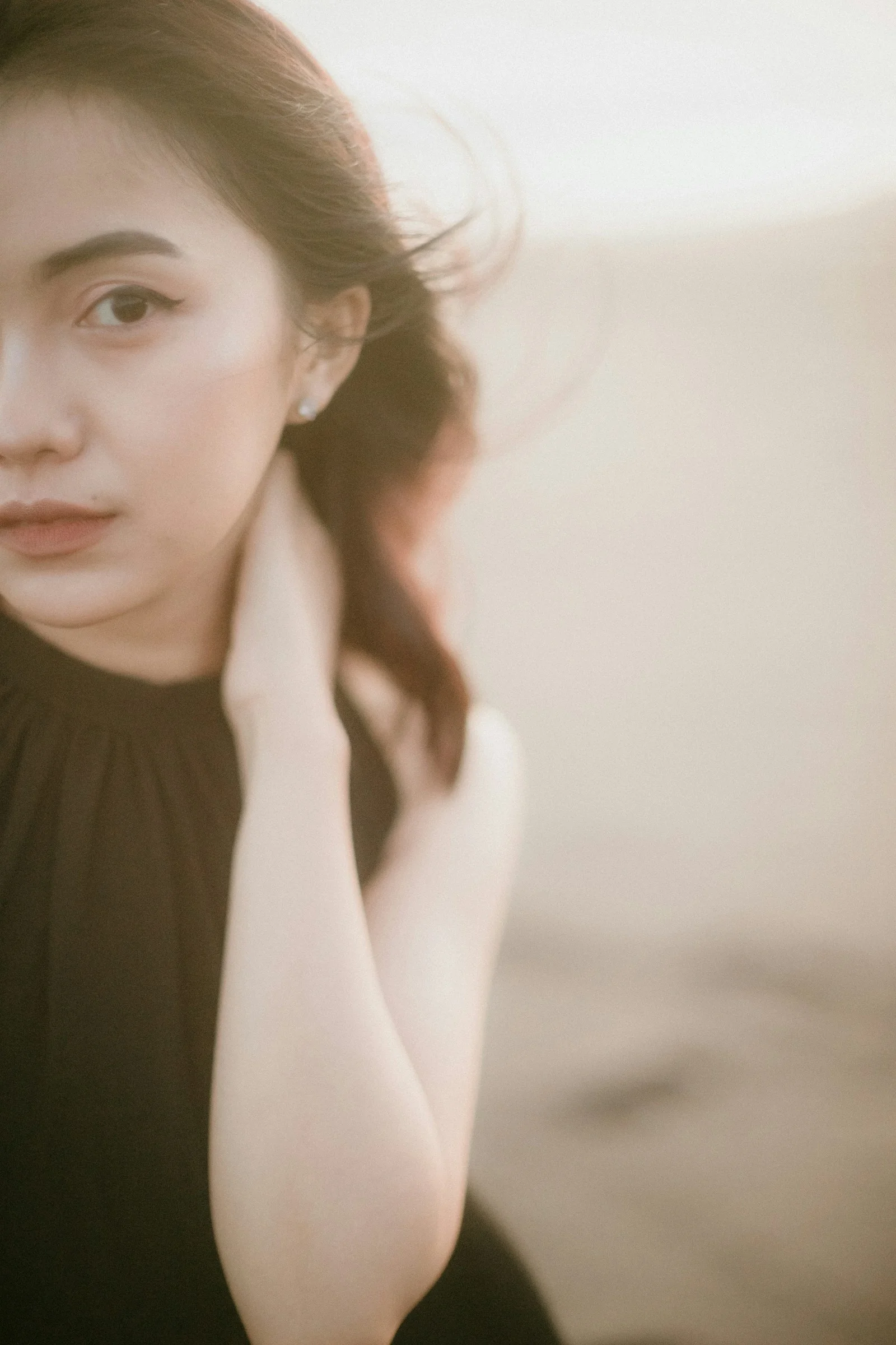 a woman in a black dress posing for a picture