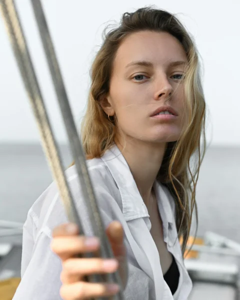 a woman holding a glass